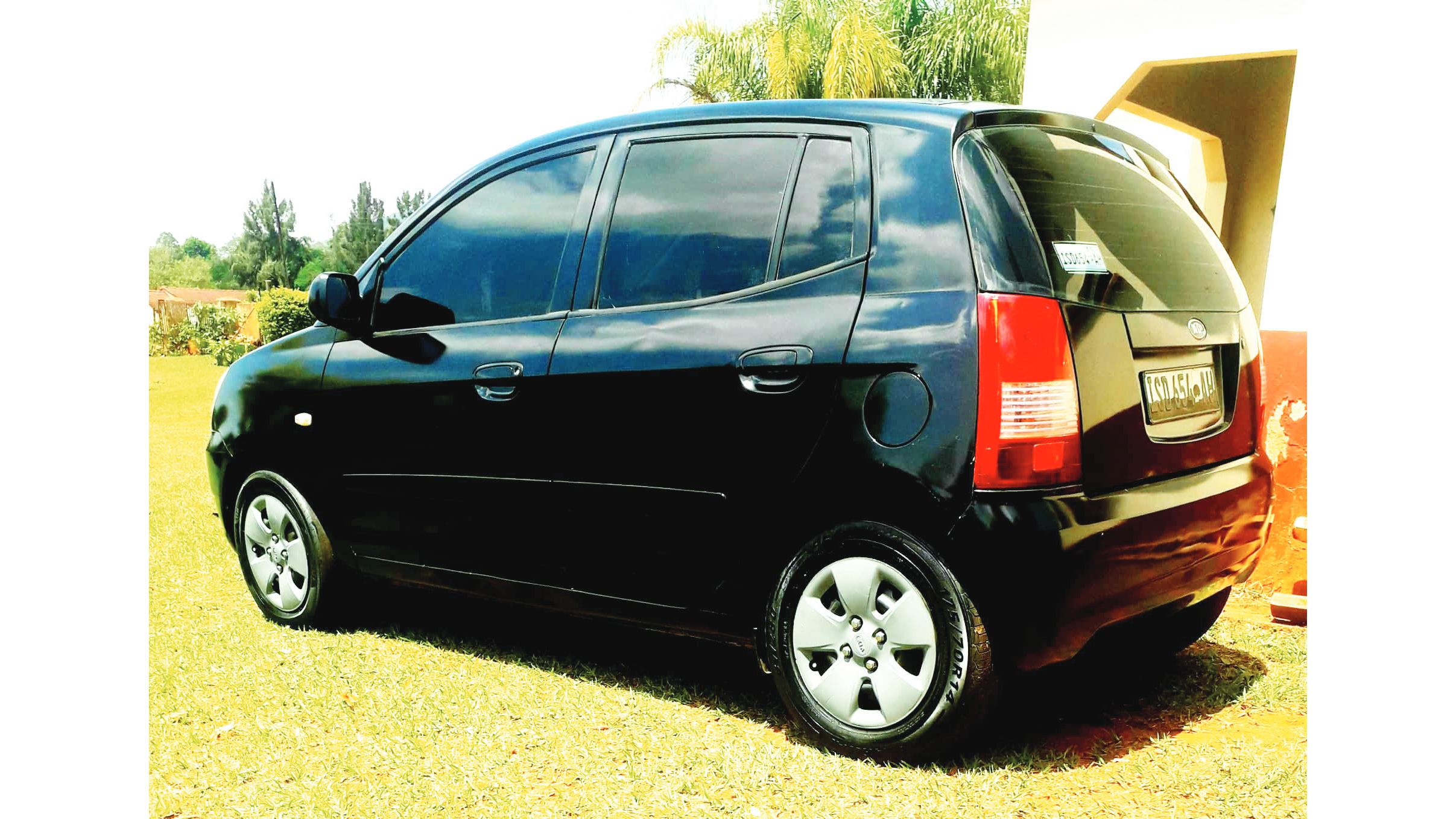 A back view of his Kia Picanto.